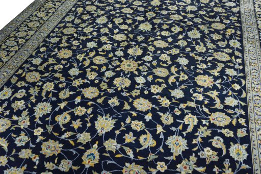 Backside of handmade 1970s Kashan rug showing knot structure and weave density