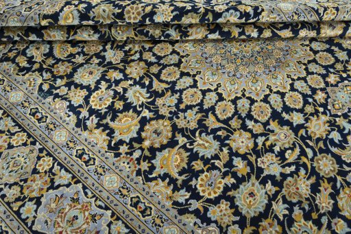 Close-up detail of 2000s Kashan rug from Iran / Persia showing Wool weave