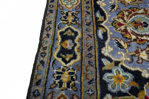 Backside of handmade 2000s Kashan rug showing knot structure and weave density