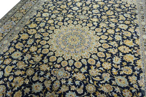 Backside of handmade 2000s Kashan rug showing knot structure and weave density
