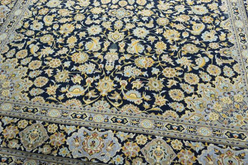 Close-up detail of 2000s Kashan rug from Iran / Persia showing Wool weave