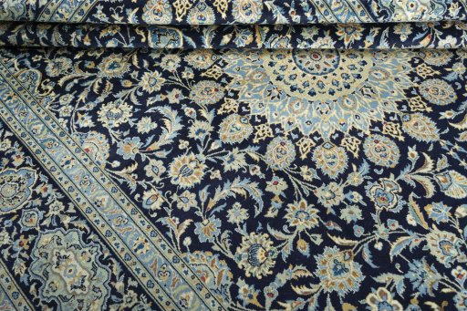 Close-up detail of 2000s Kashan rug from Iran / Persia showing Wool weave