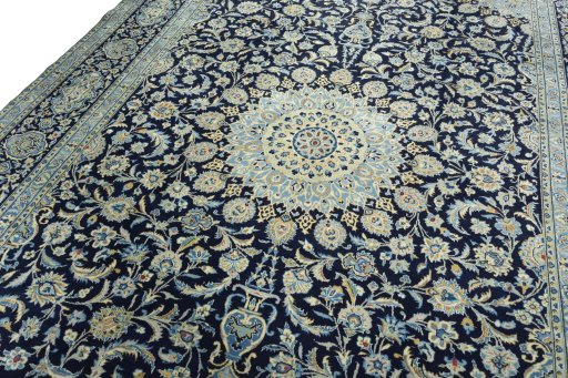 Backside of handmade 2000s Kashan rug showing knot structure and weave density