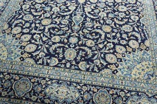 Close-up detail of 2000s Kashan rug from Iran / Persia showing Wool weave