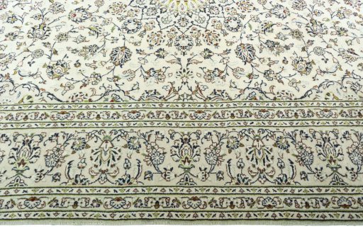 Corner detail of 2000s Kashan rug showing border pattern and Wool pile