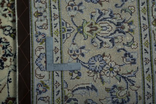 Backside of handmade 2000s Kashan rug showing knot structure and weave density