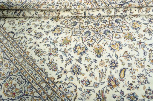 Close-up detail of 2000s Kashan rug from Iran / Persia showing Wool weave