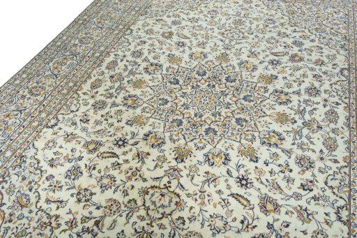Backside of handmade 2000s Kashan rug showing knot structure and weave density