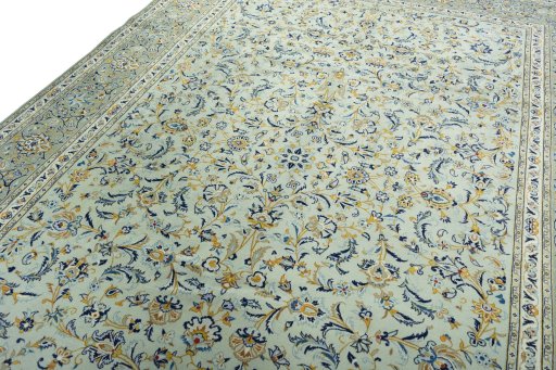 Backside of handmade 2000s Kashan rug showing knot structure and weave density