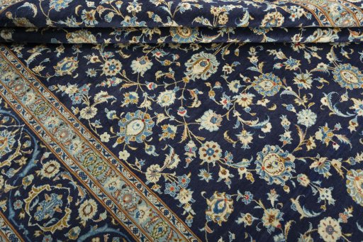 Close-up detail of 2000s Kashan rug from Iran / Persia showing Wool weave
