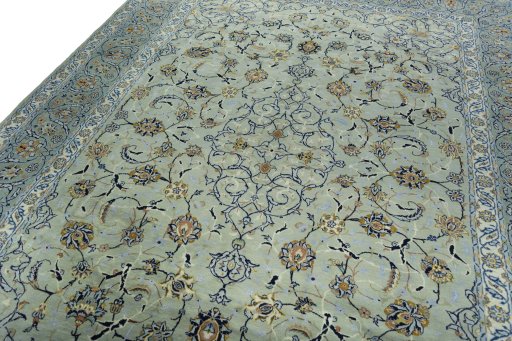 Backside of handmade 2000s Kashan rug showing knot structure and weave density