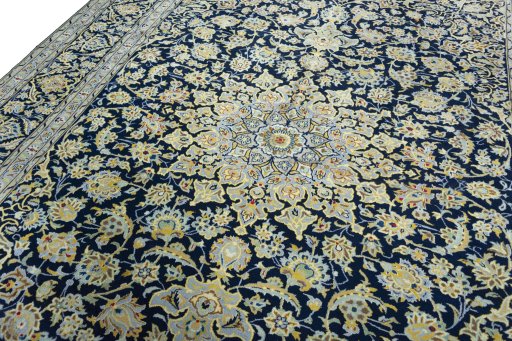 Backside of handmade 1970s Kashan rug showing knot structure and weave density