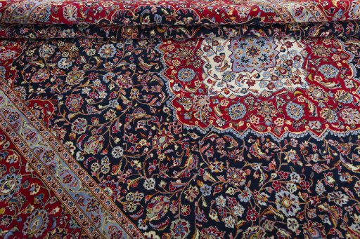 Close-up detail of 2000s Kashan rug from Iran / Persia showing Wool weave