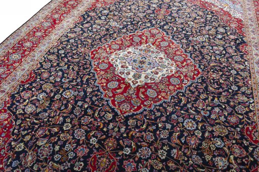 Backside of handmade 2000s Kashan rug showing knot structure and weave density