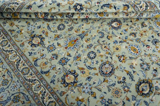 Close-up detail of 2000s Kashan rug from Iran / Persia showing Wool weave