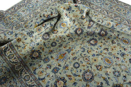 Surface texture of 2000s Kashan rug with natural Wool and intricate pattern