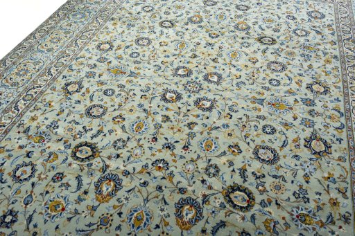 Backside of handmade 2000s Kashan rug showing knot structure and weave density