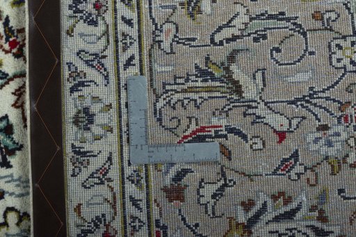 Backside of handmade 2000s Kashan rug showing knot structure and weave density