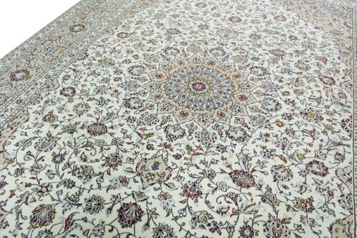 Backside of handmade 2000s Kashan rug showing knot structure and weave density