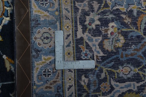 Close-up detail of 2000s Kashan rug from Iran / Persia showing Wool weave