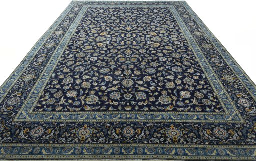 Corner detail of 2000s Kashan rug showing border pattern and Wool pile