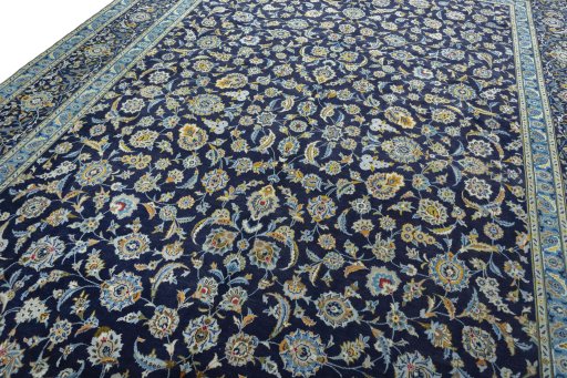 Close-up detail of 2000s Kashan rug from Iran / Persia showing Wool weave