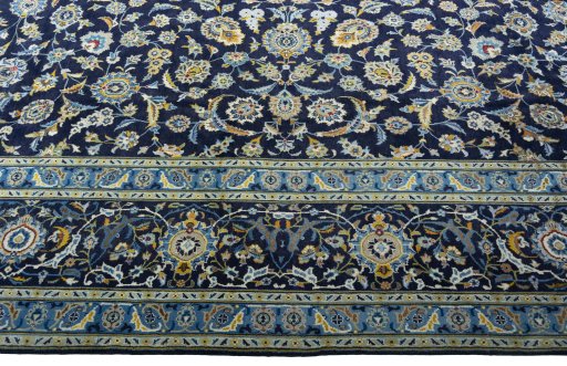 Close-up detail of 2000s Kashan rug from Iran / Persia showing Wool weave
