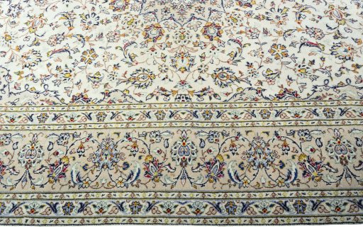 Corner detail of 1970s Kashan rug showing border pattern and Wool pile