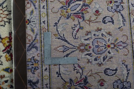 Backside of handmade 1970s Kashan rug showing knot structure and weave density