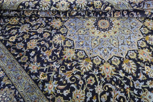 Close-up detail of 2000s Kashan rug from Iran / Persia showing Cork weave