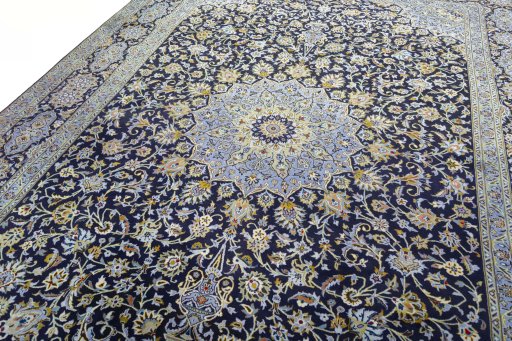 Backside of handmade 2000s Kashan rug showing knot structure and weave density