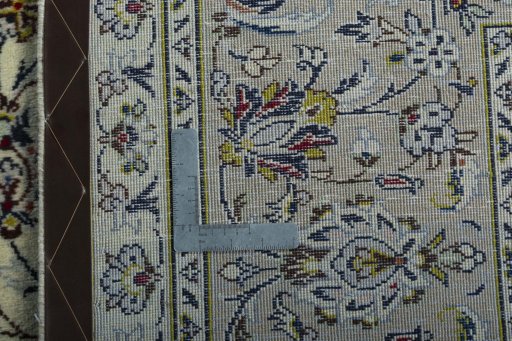 Backside of handmade 2000s Kashan rug showing knot structure and weave density