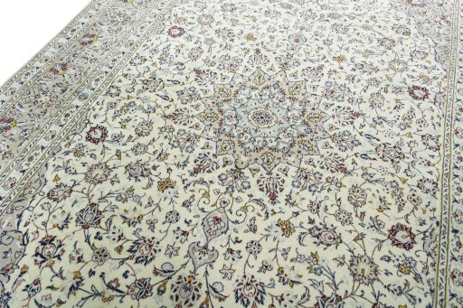 Backside of handmade 2000s Kashan rug showing knot structure and weave density