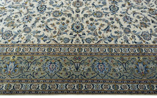 Corner detail of 2000s Kashan rug showing border pattern and Wool pile