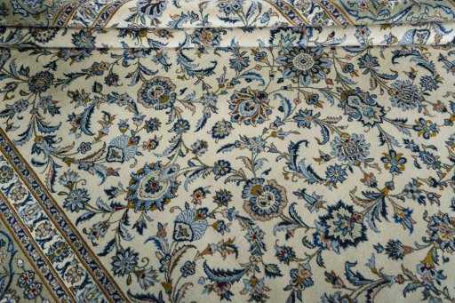 Close-up detail of 2000s Kashan rug from Iran / Persia showing Wool weave