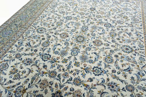 Backside of handmade 2000s Kashan rug showing knot structure and weave density