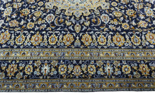 Corner detail of 1970s Kashan rug showing border pattern and Wool pile