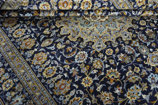 Close-up detail of 1970s Kashan rug from Iran / Persia showing Wool weave