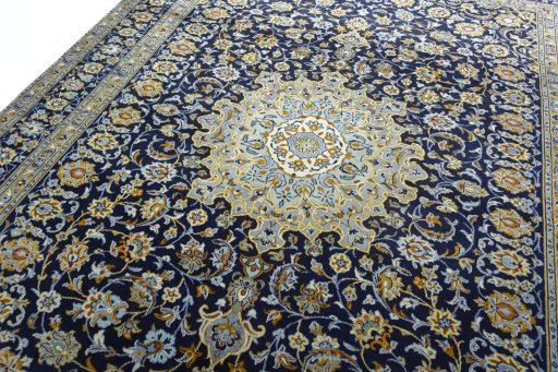 Backside of handmade 1970s Kashan rug showing knot structure and weave density