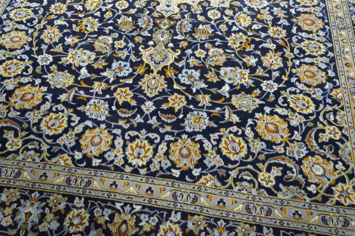 Close-up detail of 1970s Kashan rug from Iran / Persia showing Wool weave