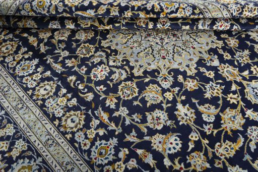 Close-up detail of 2000s Kashan rug from Iran / Persia showing Wool weave