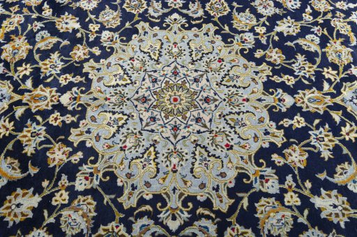 Central medallion detail of 2000s Kashan rug from Iran / Persia