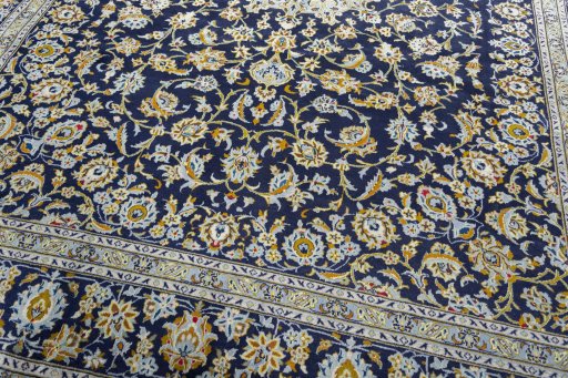 Close-up detail of 2000s Kashan rug from Iran / Persia showing Wool weave
