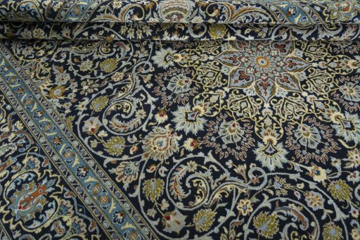 Close-up detail of 2000s Kashan rug from Iran / Persia showing Wool weave