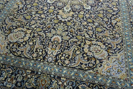 Close-up detail of 2000s Kashan rug from Iran / Persia showing Wool weave