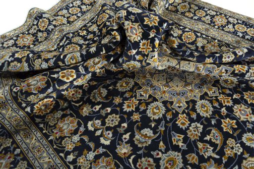 Surface texture of 2000s Kashan rug with natural Wool and intricate pattern