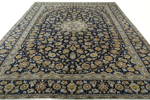 Surface texture of 2000s Kashan rug with natural Wool and intricate pattern