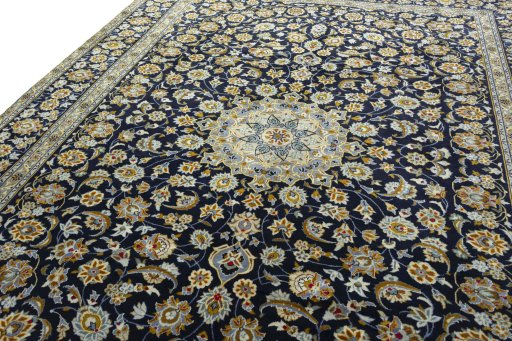 Backside of handmade 2000s Kashan rug showing knot structure and weave density