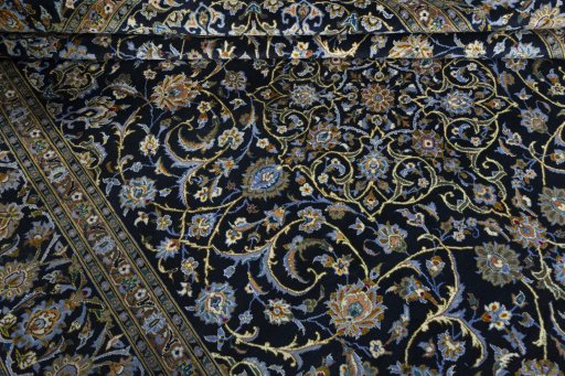 Close-up detail of 2000s Kashan rug from Iran / Persia showing Wool weave