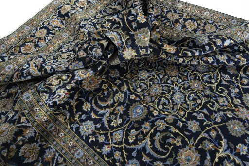 Surface texture of 2000s Kashan rug with natural Wool and intricate pattern
